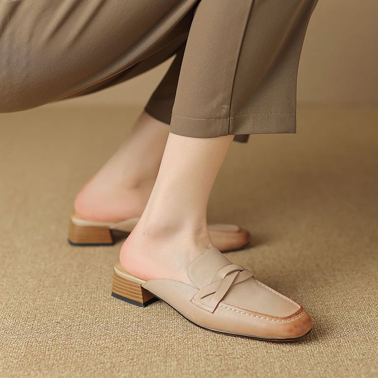 Shoes For Flying Step into comfort and style this summer with our chic Leather Mules. Perfectly designed for the office lady who loves to blend professionalism with a dash of casual flair, these slippers are a must-have for your warm-weather wardrobe. Crafted from high-quality genuine cow leather, these mules are a testament to durability and elegance. The low square heel provides just the right amount of lift, ensuring comfort throughout the day. Features Material: Premium genuine cow leather upper and pigskin lining ensure your feet stay comfortable and breathable. Heel: A modest 3cm square heel adds the perfect amount of height without sacrificing comfort. Design: Sleek, shallow-cut mules with a solid pattern and retro style, ideal for a variety of occasions. Season: Specially designed Slipper Shoes Women, Heels Slippers, Slippers Shoes, Chic Leather, Heel Slippers, Loafer Mules, Mens Shoes Boots, Women Sandals, Shoes Woman