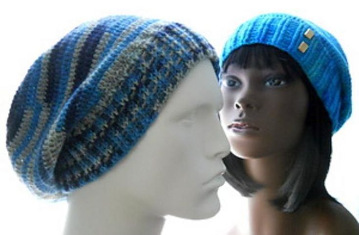 two mannequins with hats on their heads, one wearing a blue hat