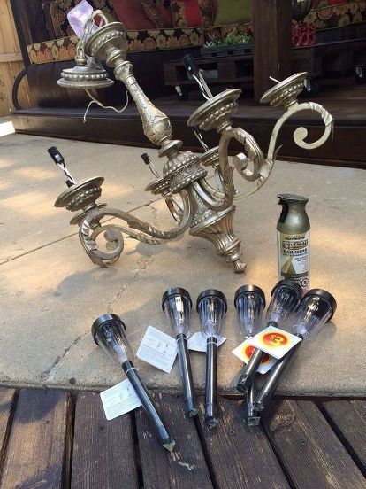 an assortment of kitchen utensils sitting on the ground