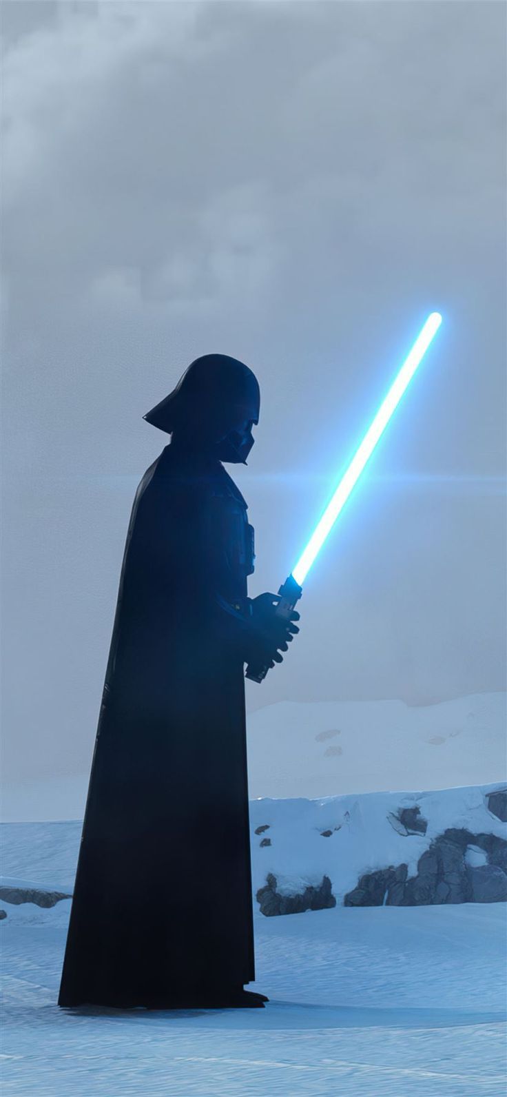 darth vader is standing in the snow with his lights on and looking at something