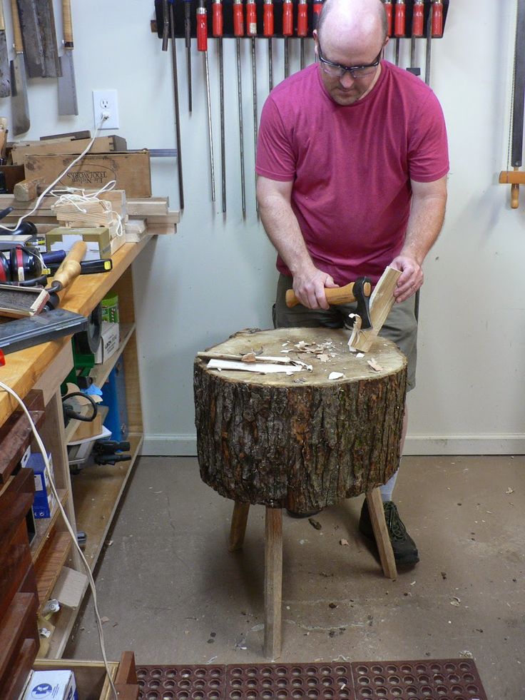 a man working on a piece of wood