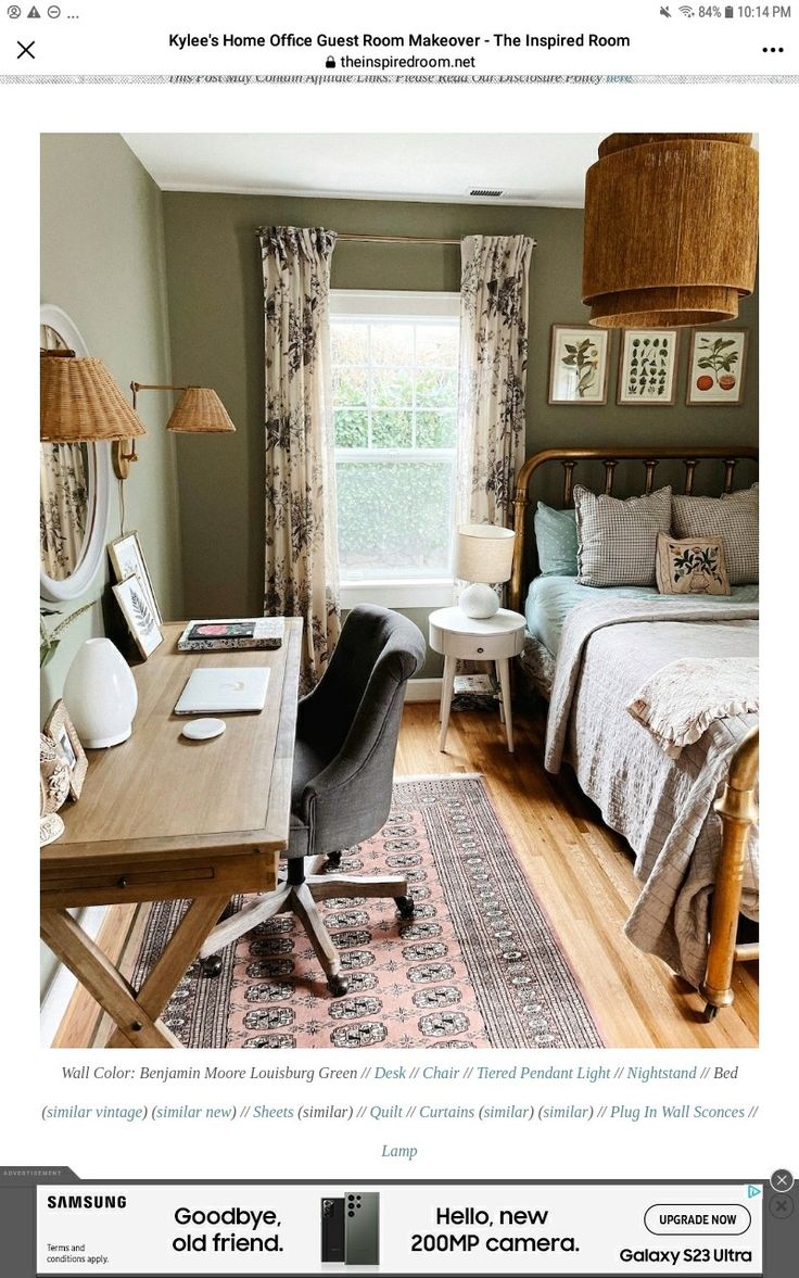 a bed room with a neatly made bed next to a desk and chair in front of a window