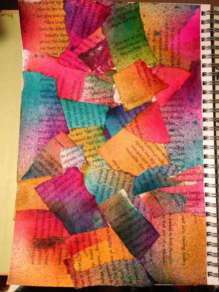 an open notebook with colorful papers on it