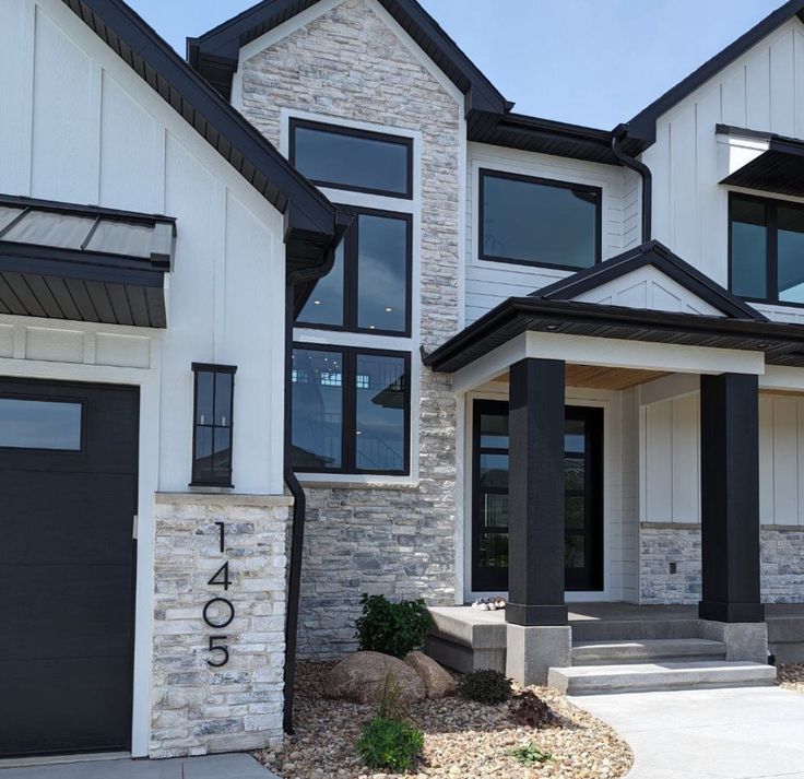 two story house with black and white trim