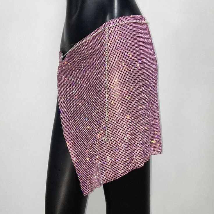 Rhinestone self-tie skirt. Size is adjustable. Can be worn by sizes XS, S, M, L, XL. Length-15” Waist-30”-46” Tie Skirt