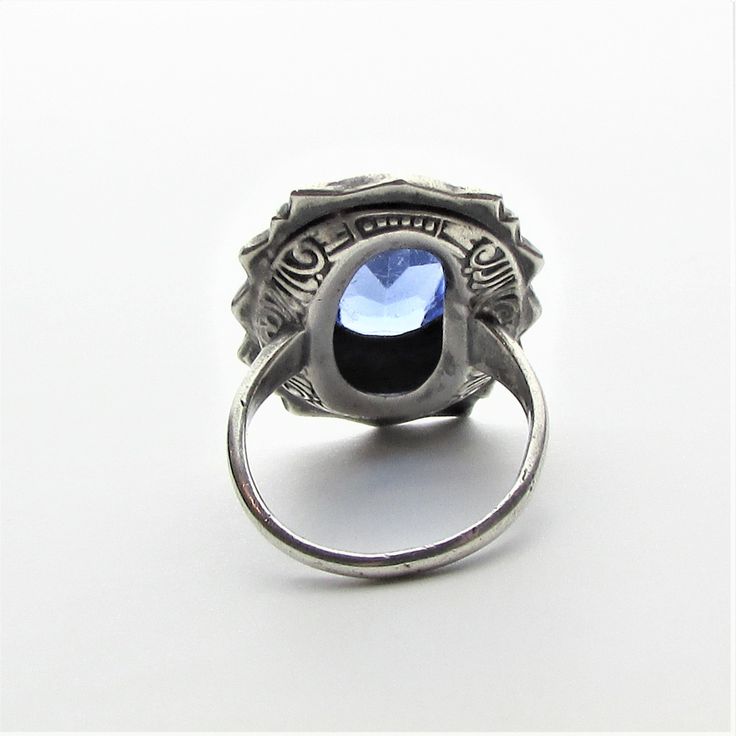 "Victorian marcasite, art glass cabochon and sterling silver statement ring, perhaps originally a mourning ring! This ring appears to be from the latter part of the 1800's and per the gemologist was typically worn with those high collared long black dresses of the period that one sees in old photos and many times as a mourning ring (also known as a memory ring). It is a large piece with the crown measuring approximately 25 mm by 19 mm. and rising a comfortable 7.5 mm from the finger to the very Antique Silver Intaglio Ring, Vintage Cabochon Sapphire Ring For Wedding, Victorian Style Cabochon Opal Ring Gift, Victorian Cabochon Opal Ring For Gift, Victorian Opal Ring For Formal Occasions, Victorian Opal Cabochon Ring As Gift, Vintage Silver Opal Cabochon Ring, Antique Oval Hallmarked Moonstone Ring, Antique Oval Moonstone Ring Hallmarked