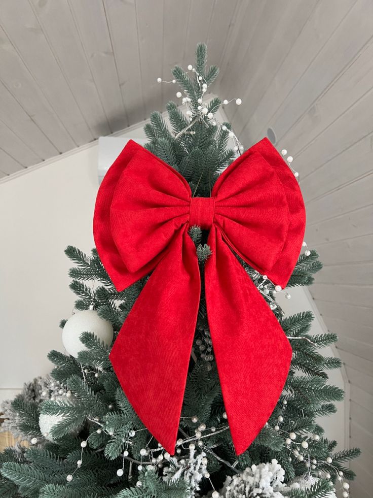 a christmas tree with a red bow on it