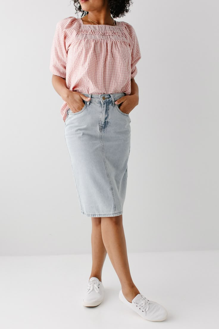 The 'Kyra' is one of our own exclusive denim skirts. Designed with everyday wear in mind, this skirt will pair well with just about any casual top in your wardrobe! This denim skirt is 100% cotton and does not have any stretch, giving it a vintage vibe we love! Every woman needs a classic, straight denim skirt in her closet, and this skirt is an excellent, durable choice! Available in light or vintage wash. 100% Cotton Machine Wash Cold Gentle Cycle Do Not Bleach Hang to Dry Do Not Dry Clean Mod Cotton Summer Skirt Jeans, Spring Relaxed Straight Leg Skirt, Summer Denim Midi Skirt, Spring Medium Wash Denim Midi Skirt, Trendy Relaxed Denim Skirt For Summer, Trendy Relaxed Fit Denim Skirt For Summer, Summer Cotton Skirt In Medium Wash, Spring Relaxed Denim Skirt, Trendy Relaxed Fit Denim Skirt