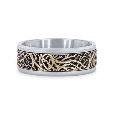 a wedding ring with gold and silver inlaying the design, on a white background