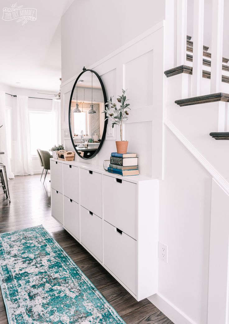 a living room filled with furniture and white walls