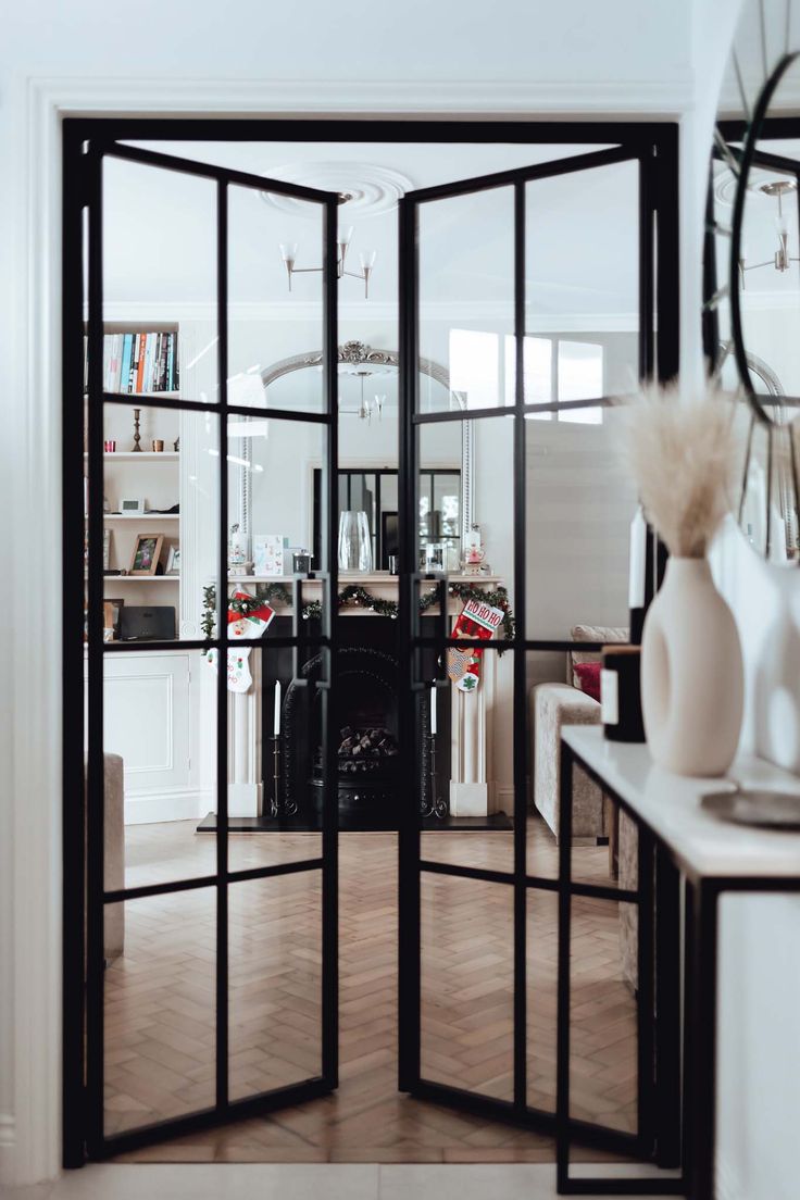 an open glass door leading into a living room