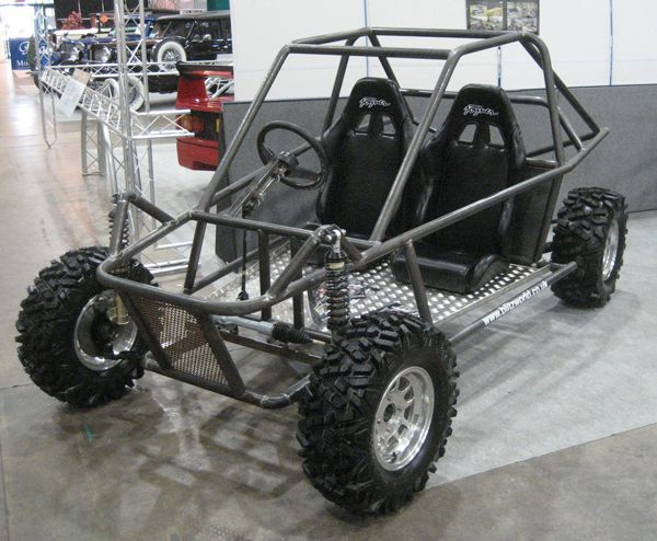 an off road buggy is on display in a showroom