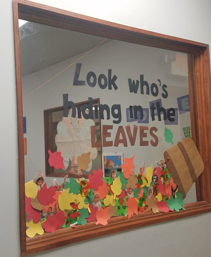 a bulletin board with fall leaves on it