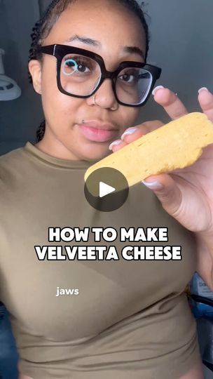 a woman wearing glasses holding up a piece of food in front of her face with the words how to make velveta cheese