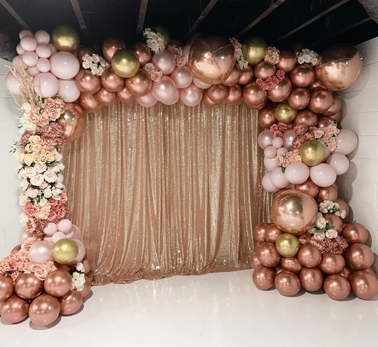 a backdrop made out of balloons and flowers