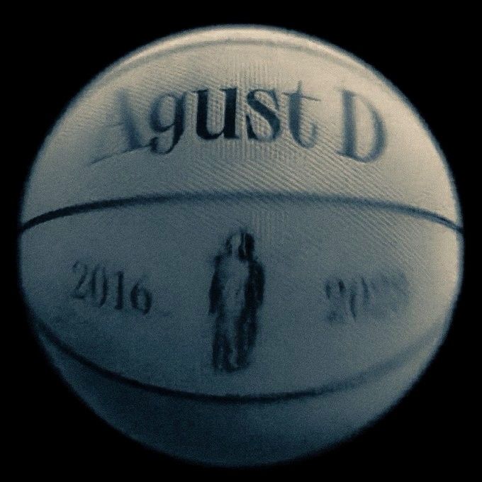 a close up view of a basketball with the words gust d on it's side