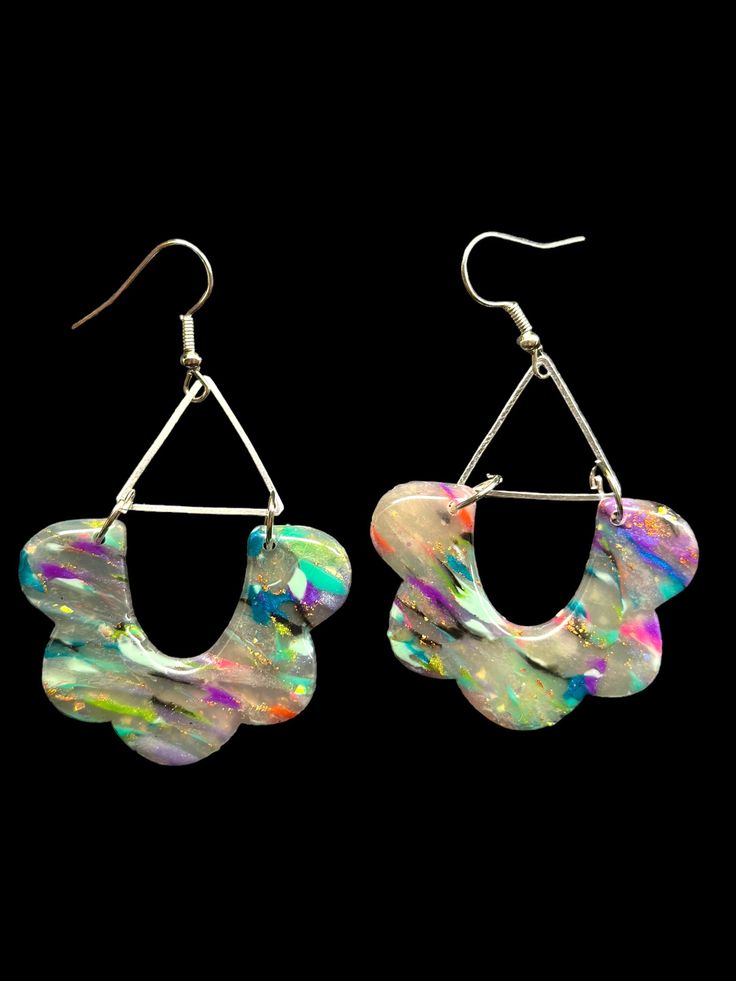 Live life in technicolor with these Color Collision Earrings! Whether you love to clash or prefer matching colors, these eye-catching earrings will bring color and personality to any look. Pops of bold and vibrant hues make for the perfect accessory for any occasion! Vibrant Rainbow Dangle Earrings, Nickel-free Rainbow Jewelry For Party, Colorful Vibrant Earrings With Ear Wire, Rainbow Metal Earrings With Ear Wire, Vibrant Rainbow Drop Earrings, Trendy Colorful Earrings As Gift, Trendy Colorful Earrings For Gift, Modern Multicolor Dangle Earrings, Rainbow Metal Earrings