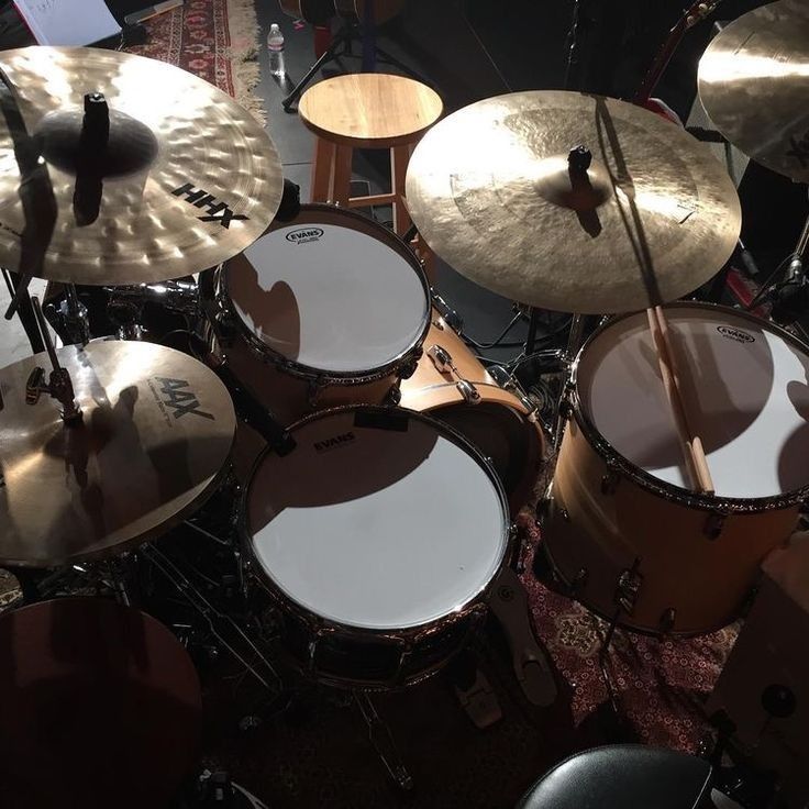 a drum set up on top of a wooden table