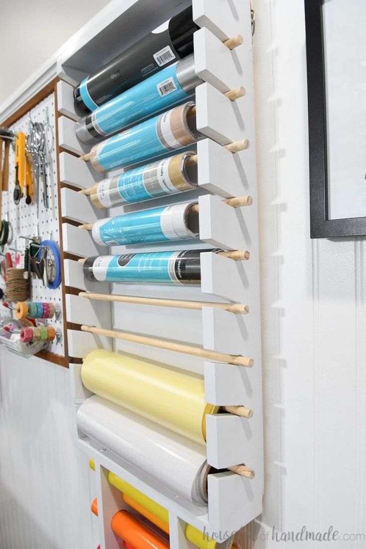 an organized craft room with rolling pins and crochet hooks