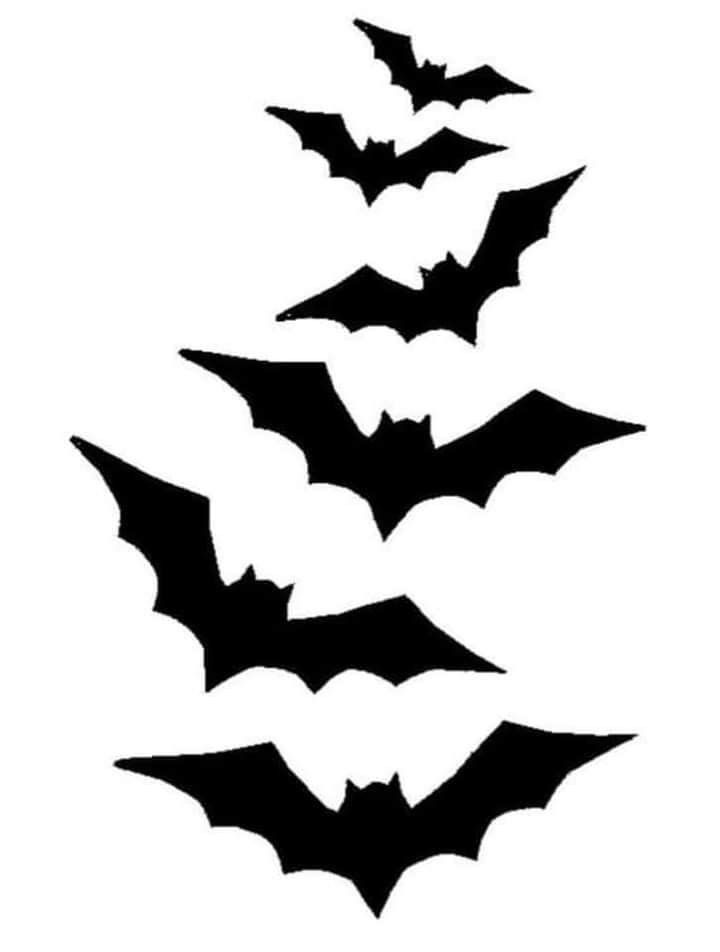 bats flying in the air with their wings spread out to form a christmas tree, silhouetted against a white background