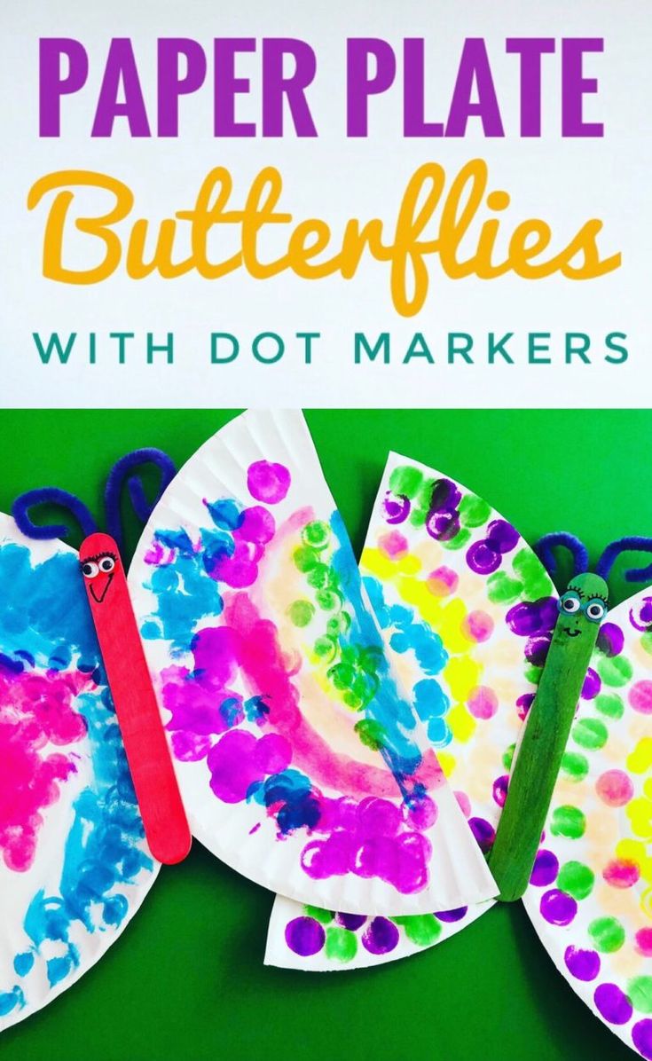 paper plate butterflies with dot markers are on the green background and there is a sign that says, paper plate butterflies with dot markers