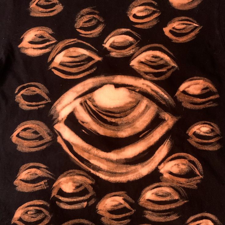 an image of a black t - shirt with brown circles on it