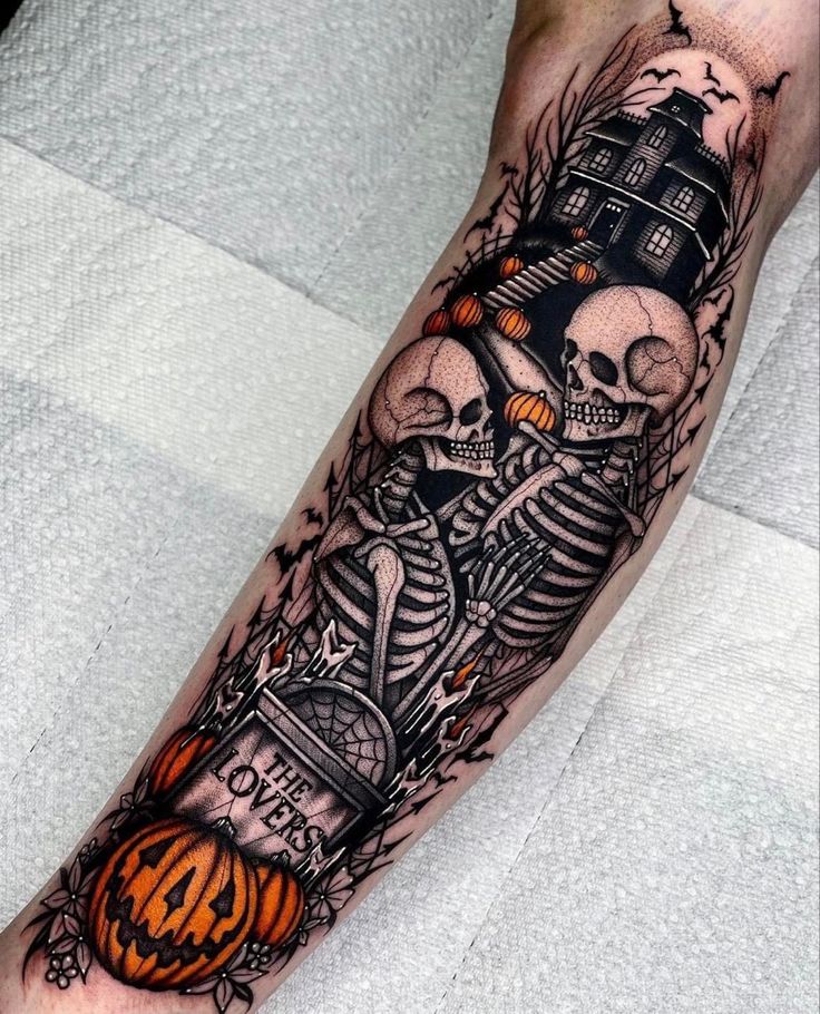 a man's leg with a skeleton and pumpkins tattoo on his arm,