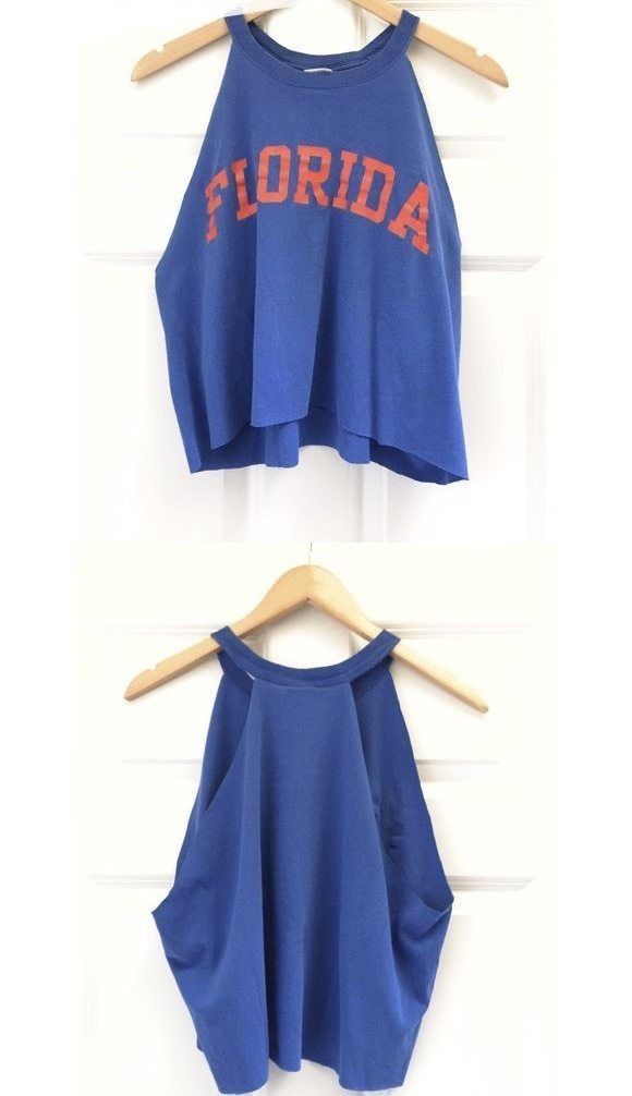 two pictures of the same crop top on hangers, one in blue and one in red