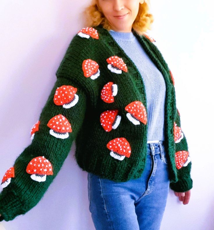 COLOR: green SIZE: XS, S,.M,.L PATTERN:mushroom AREA OF USE: can be used in all seasons LENGTH: 50cm, 55cm The handmade mushroom cardigan, which has become the most trendy fashion of recent times, is knitted with green thick and soft yarn, embroidered with orange mushrooms, and is suitable for sizes S, XS, M and L. This cardigan, which keeps you soft and warm and is an indispensable complementary clothing style for the autumn and winter months, will reach you as soon as possible with the most reliable cargo service. With its emerald green color and orange mushroom embroidery, which is the most suitable color, you will enjoy wearing this cardigan, which is completely handmade, and even give it to your loved ones on their birthdays. You will be able to gift it as a gift on Valentine's Day an Green Knitted Winter Cardigan, Winter Green Knitted Cardigan, Green Knitted Fall Cardigan, Green Knit Crew Neck Cardigan, Green Knitted Acrylic Cardigan, Cozy Green Acrylic Cardigan, Green Casual Acrylic Cardigan, Green Chunky Knit Winter Cardigan, Winter Green Chunky Knit Cardigan