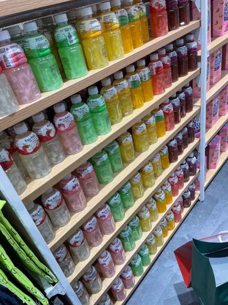 a store shelf filled with lots of different colored drinks