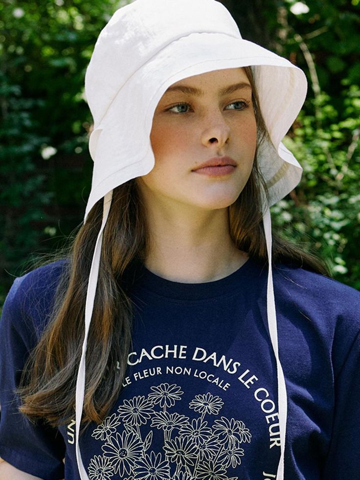 NONLACAL reinterprets the classic mood and pursues a timeless design that can be kept for a long time with a silhouette and sensitive materials that capture natural beauty in everyday life.- Brand logo made of mother-of-pearl point- Daily silhouette designed bucket hat- Light cotton fabric used- Minimal design for a variety of looks Natural Color Hats For Spring Everyday Wear, Classic Cotton Sun Hat For Spring, Everyday Cream Sun Hat With Curved Brim, White Adjustable Bonnet With Curved Brim, Everyday White Hats With Upf 50+, White Everyday Hats With Upf 50+, White Everyday Hat With Upf 50+, White Curved Brim Sun Hat For Everyday, Everyday White Sun Hat With Curved Brim