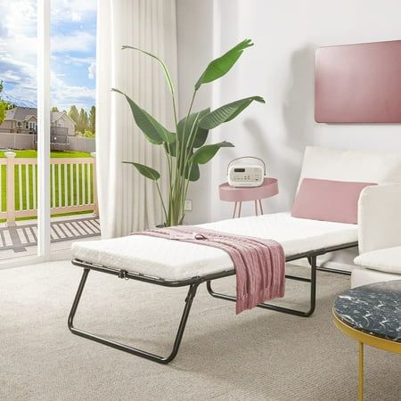 a living room filled with furniture and a sliding glass door