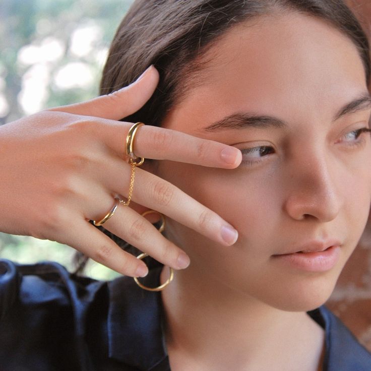 Gold vermeil and sterling silver ring set with chain Innovative, edgy, & feminine. Elevate any outfit with this modern take on the chain ring.From day to night, wear this set three ways - let the chain drape for an editorial look or wrap it and stack it to create the illusion of a third band. Can't decide between silver & gold? Simply rotate to style a new way every day.Rings are sized for ring and pointer fingers ie. 6 for ring, 7 for pointer = 6/7 Details This style is not offered in h Everyday 14k Gold Rings With Adjustable Chain, Minimalist Everyday Tarnish Resistant Jewelry, Everyday Minimalist Tarnish Resistant Jewelry, Modern Jewelry With Ring Detail, Minimalist Round Chain Jewelry, Minimalist Gold-plated Chain Jewelry, Gold Chain Jewelry With Open Ring Design, Minimalist Open Band Ring Jewelry, Everyday Double Band Gold Jewelry