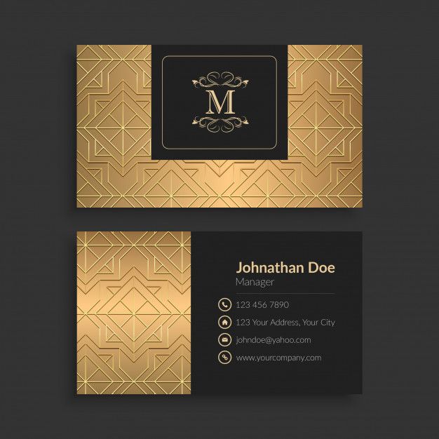 a gold business card with an elegant monogrammed design on the front and back