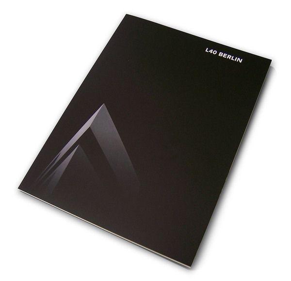 the book is black and has a triangular design on it's front cover,