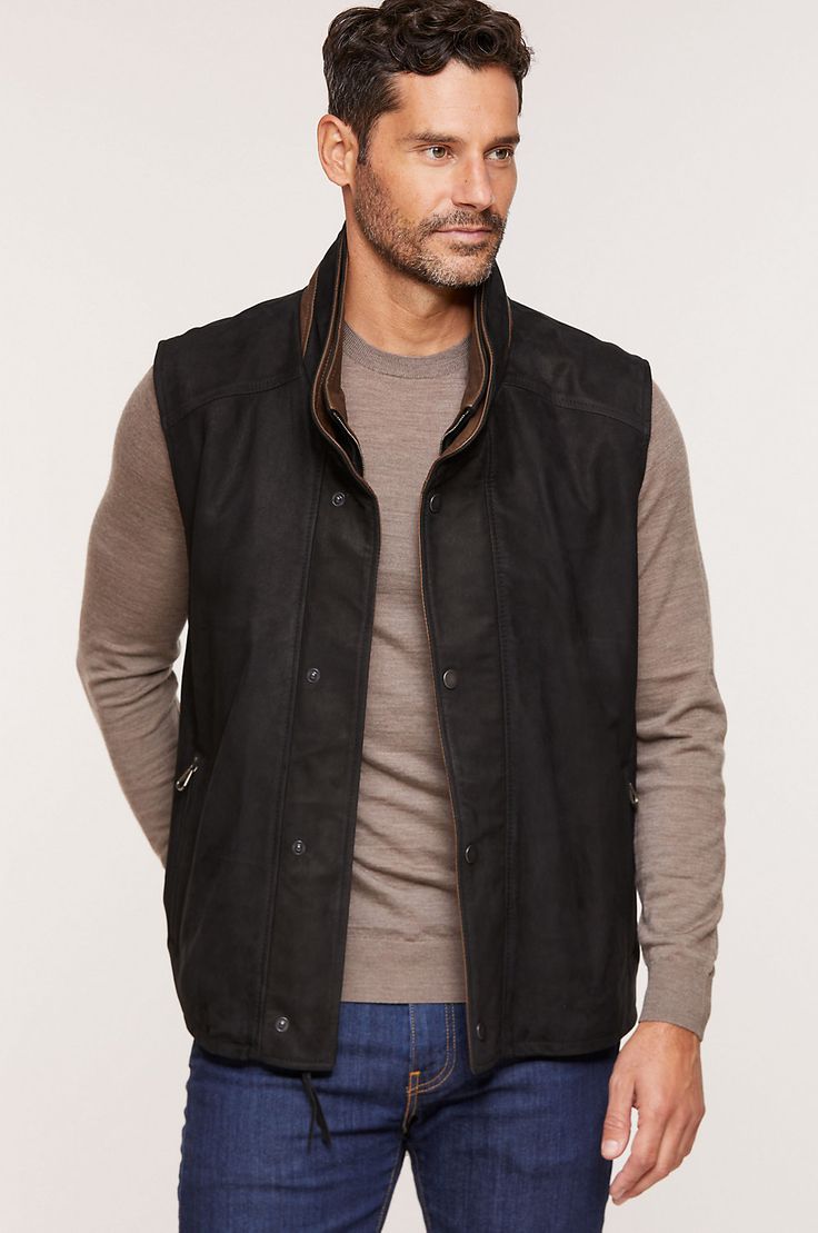 For crisp spring and fall days when you need a lightweight layer of warmth, slip on the handsome Falcon Leather Vest, crafted from buttery soft Italian lambskin with a rich, sueded feel. Its wool lining and full zip front with snap-over placket keep you toasty warm, while two double front pockets (slip over zip) and three interior pockets offer plenty of space for keys, gloves, and cell. With snap tabs at the waist. Classic Leather Vest For Workwear, Fitted Leather Vest Outerwear, Black Leather Spring Vest, Fitted Leather Outerwear For Layering, Black Leather Vest For Spring, Fitted Leather Winter Vest, Fitted Leather Vest For Winter, Fitted Leather Vest For Fall, Casual Leather Vest For Spring