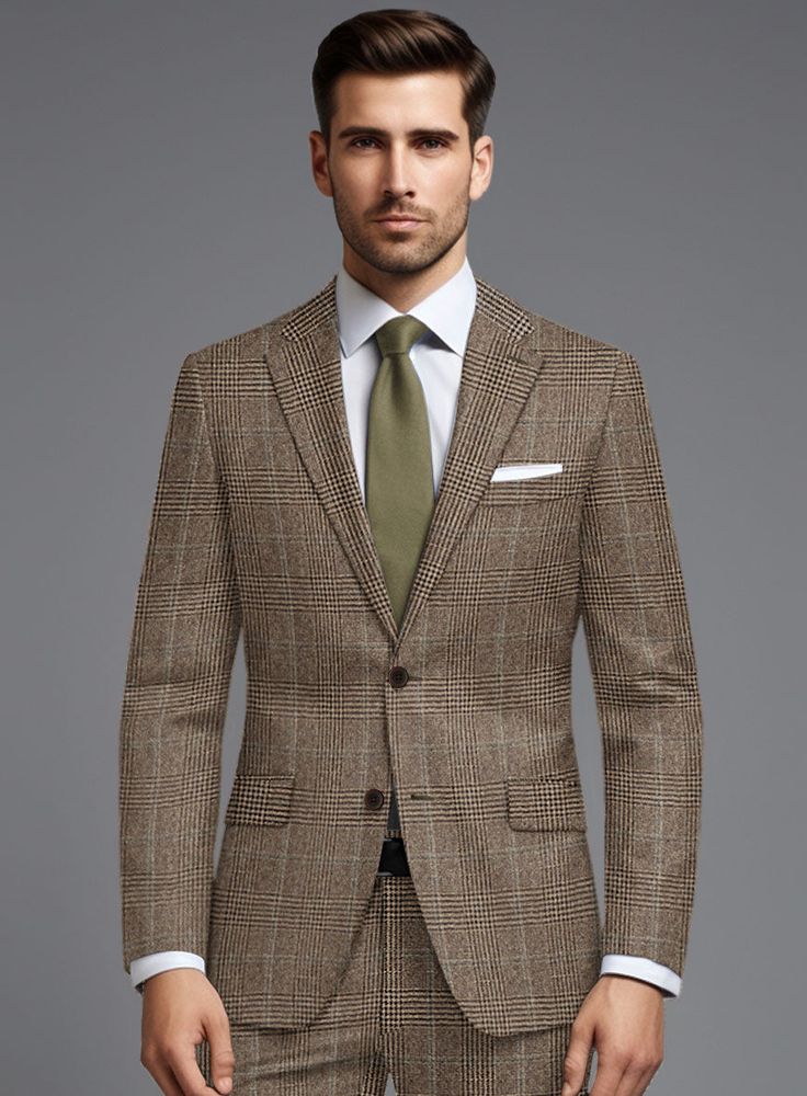 Introducing our exquisite Loro Piana Rosario Wool Jacket, a true epitome of style and sophistication. Crafted from the finest pure wool, this jacket redefines elegance with its captivating plaids pattern in mesmerizing shades of brown, imparting a distinctive touch to its timeless charm. What truly sets it apart is the luxurious feel of the fabric and its natural drape, enhancing the wearer's silhouette in every stride. Whether you're making a grand entrance at a dazzling soirée, navigating the Green Tweed Suit, Blue Linen Suit, Red Corduroy Jacket, Brown Tweed Suit, Blue Linen Pants, Tweed Pants, Herringbone Tweed, Grey Tweed, Tweed Suits