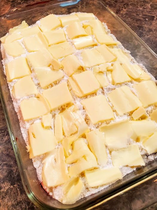 a pan filled with lots of cheese on top of a counter