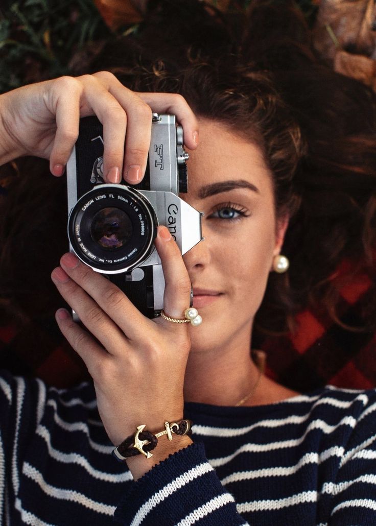 a woman taking a photo with her camera