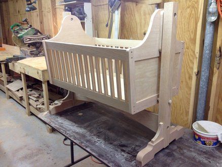 an unfinished crib being worked on in a shop