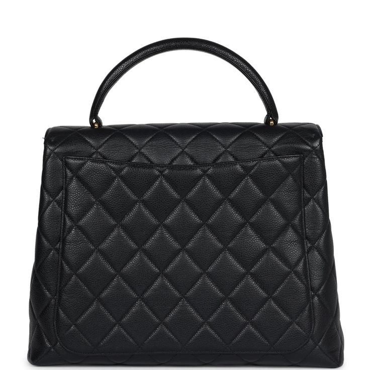 This vintage Chanel Kelly Top Handle Flap Bag is in black caviar leather with gold hardware, featuring the signature CC turnlock closure with front flap, half moon back pocket and a black rolled top handle.The interior is lined in black leather and includes one zip pocket with logo pull and a slip pocket underneath on the rear wall.Collection: 4-series (1996-1997)Origin: FranceCondition: Vintage; Excellent to Mint - This bag retains its structure. There is no plastic on the hardware which shows moderate scratching. There's some light creasing to the exterior leather but not other signs of wear. The interior is clean with a few small press markings to the interior base. Date stamp sticker is still intact.Accompanied by: Chanel box, dustbag, carebook, COA cardMeasurements: 12" width x 9" hei Chanel Kelly, Hermes Birkin 35, Date Stamp, Chanel Box, Hermes Birkin 25, Hermes Birkin 30, Birkin 25, Black Caviar, Vintage Chanel