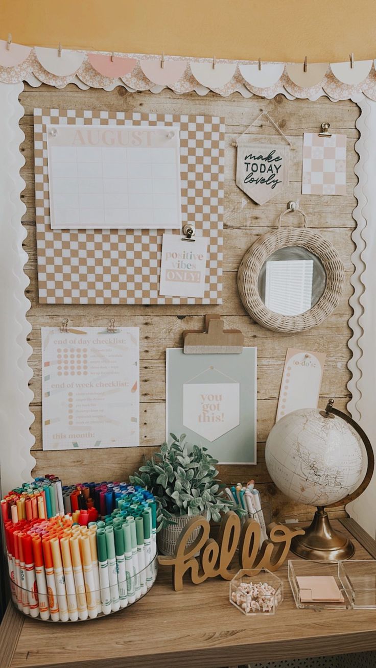 a desk with many items on it and a globe in the corner next to it