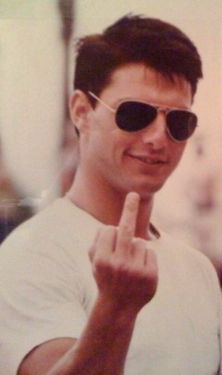 a man in sunglasses giving the peace sign