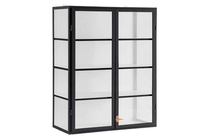 a tall black and white cabinet with glass doors on the front, two shelves below