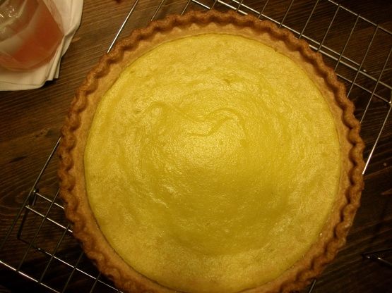 a yellow pie sitting on top of a metal rack