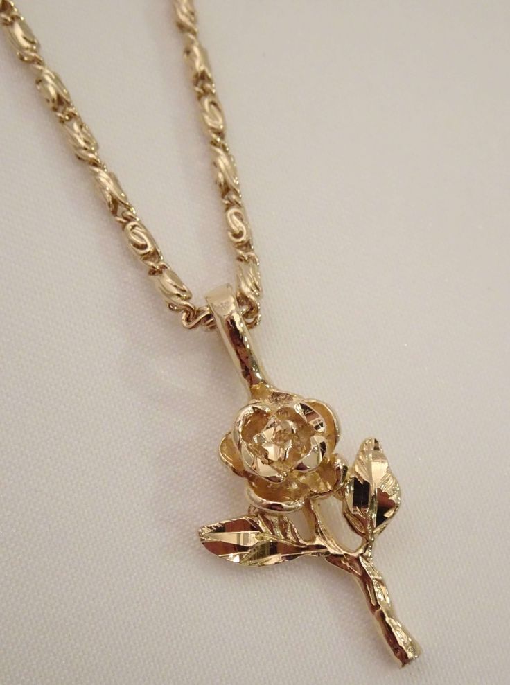 The Rose Necklace is a blooming beauty. It's the ultimate golden rose necklace that is sure to make all other rose flower necklaces jealous. This dainty darling features a diamond cut rose pendant and is available in a silver rose necklace too! This piece is available in 24K gold or rhodium plating over brass. Patent plating & sealant technology to ensure durability and long lasting wear Made in Los Angeles, CA | Nickel & Lead Free Dope Jewelry Accessories, Flower Necklaces, Pretty Jewelry Necklaces, Rose Stem, Golden Necklace, Jewelry Accessories Ideas, Dope Jewelry, Rose Pendant, Rose Necklace