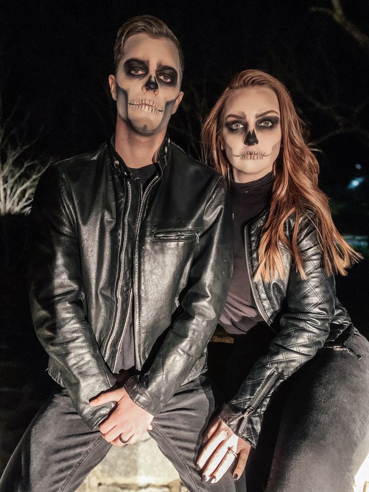 a man and woman dressed up in skeleton makeup