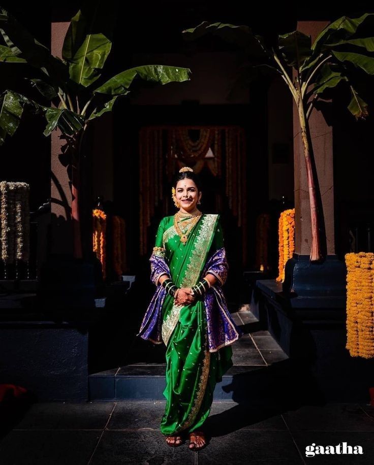 a woman in a green and purple sari