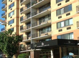 an apartment building with balconies on the second floor