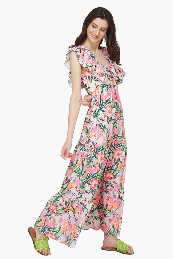 Look stunning in the Paradise Pink Floral Maxi Dress. This beautiful dress is made in a poly silk blend and features a stunning floral pattern. The drawstring ties at the back neck provide an adjustable fit while the elasticated waist ensures a comfortable fit. The tiered ruffled pattern adds to its charm while the ruffled sleeves gives it a flirty look. Perfect for any special occasion, you're sure to look and feel amazing in this gorgeous maxi dress. A beach destination's favourite, style it w Boho Queen, Pink Floral Maxi Dress, Gorgeous Maxi Dresses, Leopard Bag, The Paradise, Ruffled Sleeves, Bag Dress, Floral Maxi, Hand Beading